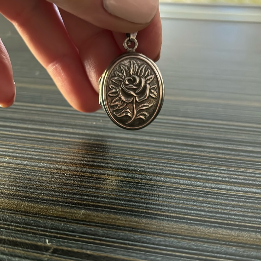 Vintage sterling silver locket with rose design on both sides